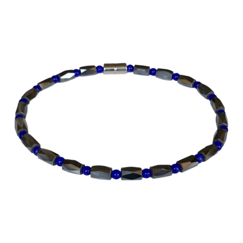 A vibrant magnetic anklet featuring faceted gunmetal hematite barrels and royal blue crystal spacers with a sleek silver magnetic clasp