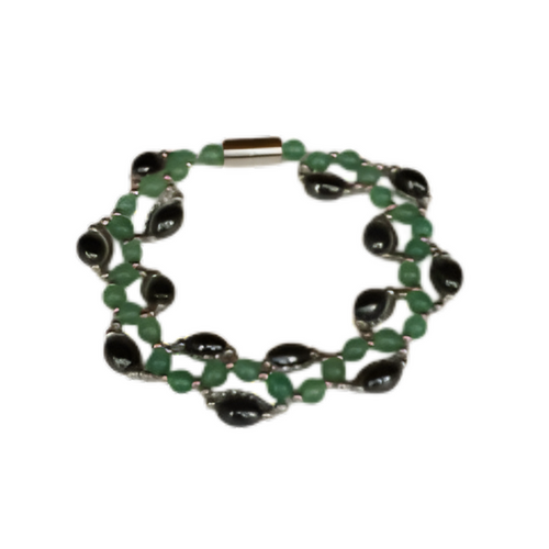 A fashionable bracelet designed with layered green seed beads and dark black stone elements, featuring an easy-to-use magnetic clasp.