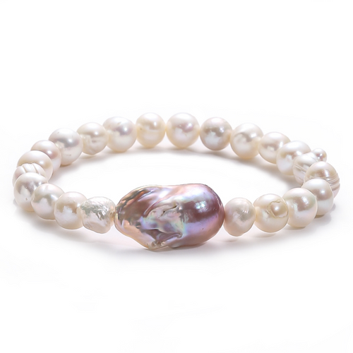A single-strand beaded bracelet featuring round, lustrous white pearls and a large, central baroque pearl. The centerpiece pearl has a unique, organic shape with vibrant iridescent lusters of pink, purple, and green, displayed against a clean white background.