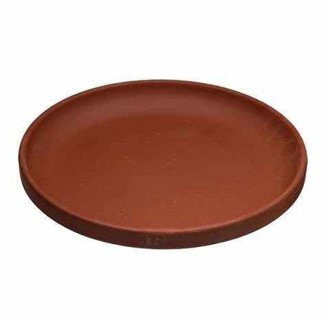 Ceramic backflow burner plate, circular with a smooth reddish-brown surface and raised edges.