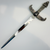 Front view of a silver-colored Egyptian dagger with winged scarab crossguard and detailed handle.