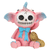 Colorful resin elephant figurine with a pink body, blue accents, a skeleton face, and a bow, holding a textured peanut.