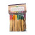 Close-up of packaged Palo Santo sticks bound in vibrant, multicolored threads inside transparent retail wrapping.