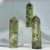 Three milky green prehnite points with dark inclusions Three milky green prehnite points with dark inclusions