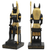 Seated Anubis statue holding staff, black and gold Egyptian decor figurine