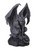 Dark gray gargoyle statue in a crouching position, with muscular features, fierce expression, and bat-like wings, sitting on a rocky base.
