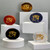 Five power stones arranged in a display, showcasing the Eye of Horus symbol on red jasper, black obsidian, tiger eye, sodalite, and clear quartz.