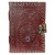 Front view of a dark brown leather journal, intricately embossed with a winged dragon perched above a circular spiderweb design, which contains a vibrant amethyst gemstone. The journal features a detailed, braided border and is secured by a metal clasp lock system