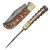 View of a folded knife showing the patterned blade, reddish-orange/white wood handle, gold rivets, and brass bolster; the other open, revealing a long Damascus blade with filework, and the detailed handle.