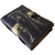 Side profile of handcrafted Grim Reaper leather journal showing page thickness, leather binding, and cover artwork.