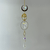 Hanging citrine tree-of-life suncatcher with gold wirework, faceted crystals, and a large heart-shaped pendant.