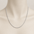 Delicate sterling silver chain necklace displayed on a mannequin, highlighting its elegant shine and minimalist style.