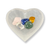 Selenite heart bowl holding colorful polished crystals in pink, blue, yellow, and green.