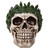 Decorative cream-colored skull made of cold-cast resin, adorned with a wreath of vibrant green cannabis leaves around its crown.
