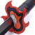Close-up, diagonal view of Tanjiro's Demon Slayer Sunbreathing Sword hilt, featuring a flame-shaped red and black guard. A small red symbol is visible on the black blade near the hilt.