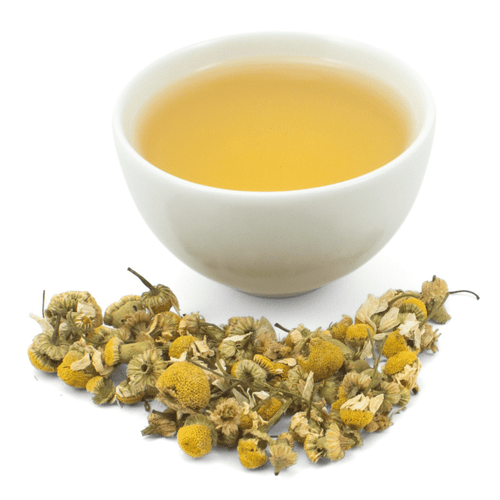 cup of tea with loose leaf flower