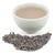 cup of tea with loose leaf flower