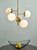 Bombazine 5 Light Natural Brass & Opal Glass Pendant Light