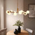 Aaron 10 Light Brushed Aged Brass with Matt Opal Spheres Pendant Light