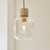 Travi Vintage Brass with Travertine Stone with Clear Shade Pendant Light
