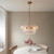 Montrose 6 Light Brushed Aged Brass with Clear Curved Glass Pendant Light