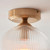Ashcroft Brushed Aged Brass with Ribbed Clear Shade Flush Ceiling Light