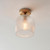 Ashcroft Brushed Aged Brass with Ribbed Clear Shade Flush Ceiling Light