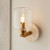 Travi Vintage Brass with Travertine Stone with Clear Shade Wall Light