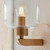 Travi Vintage Brass with Travertine Stone with Clear Shade Wall Light