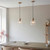 Travi Vintage Brass with Travertine Stone with Ribbed Clear Shade Pendant Light