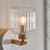 Travi Vintage Brass with White Marble with Ribbed Clear Shade Wall Light