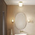 Aquina Matt Brushed Brass with Clear Shade IP44 Bathroom Wall Light