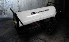L.B. White Tradesman K400 portable kerosene heater in an agricultural building