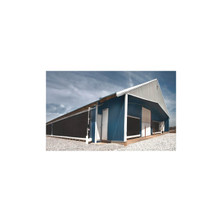 Reeves wrap-around evaporative cooling installation along the side and front of an agricultural building; representative configured installation