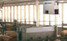 L.B. White Classic forced-air heater installed beside swine pens; representative installation
