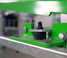 Close-up of Crystal Spring Freedom Stall mounting hardware on the green upper frame