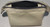 Made with rare bone white chrome tan leather and black polyester waxed thread and a metal toothed zipper for enduring quality.