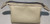 Made with rare bone white chrome tan leather and black polyester waxed thread and a metal toothed zipper for enduring quality.