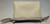 Made with rare bone white chrome tan leather and black polyester waxed thread and a metal toothed zipper for enduring quality.