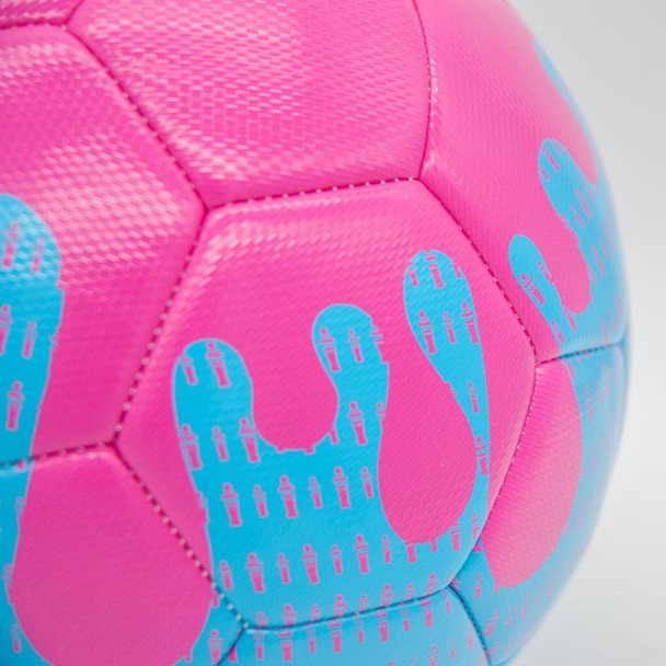 Pink paint dripping off soccer ball