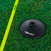 Soccer slalom poles with rubber base anchors, set up on artificial turf for agility practice