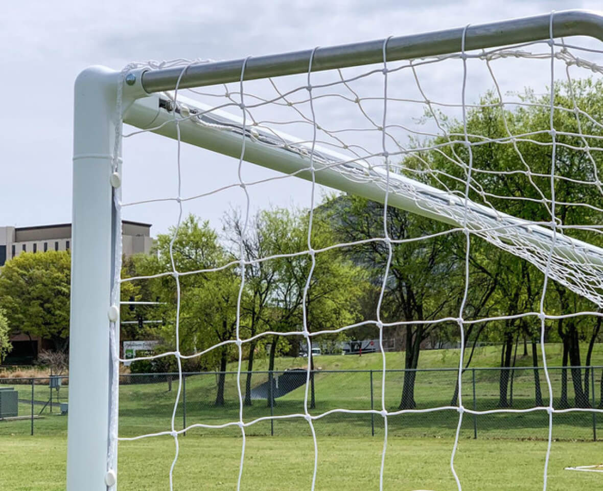 Stack of white soccer nets ready for use in school and university leagues