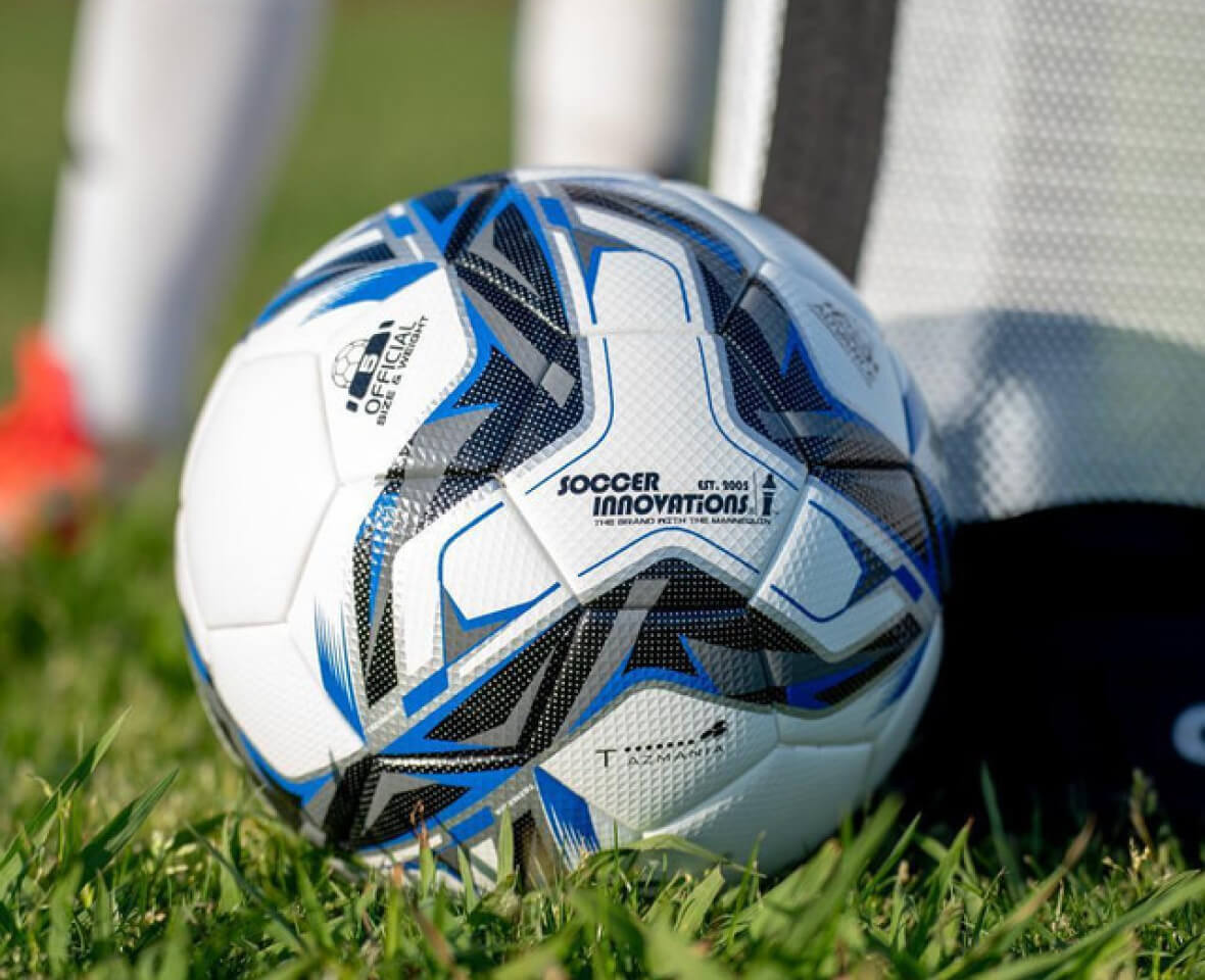 Close-up of a soccer ball with a blue and black pattern.