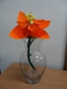 A completed origami flower on display.
