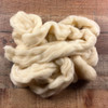 Carded wool in a pile.