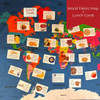 The lunch cards on top of a world fabric map.