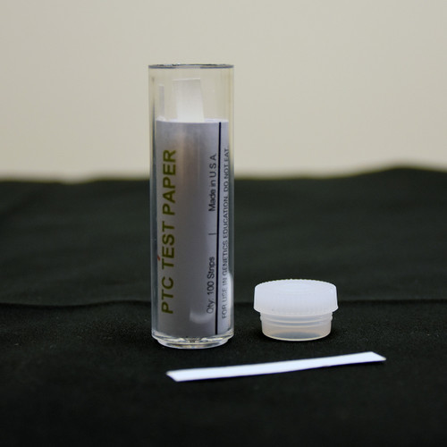 The bottle of PTC paper with a strip laying out.