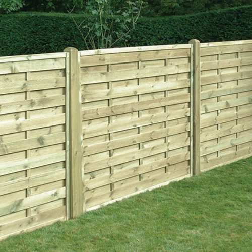 A KDM branded square horizontal panel 1.8m x  1.8m stood up in a garden in a row.