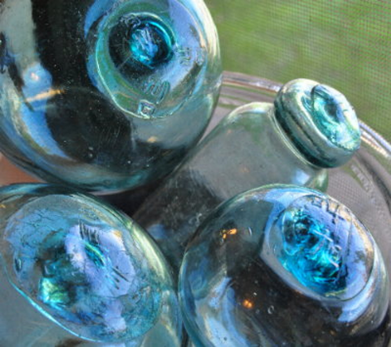 Hand blown Japanese glass fishing floatfull of bubbles and imperfections  in the true spirit of wabi sabi.