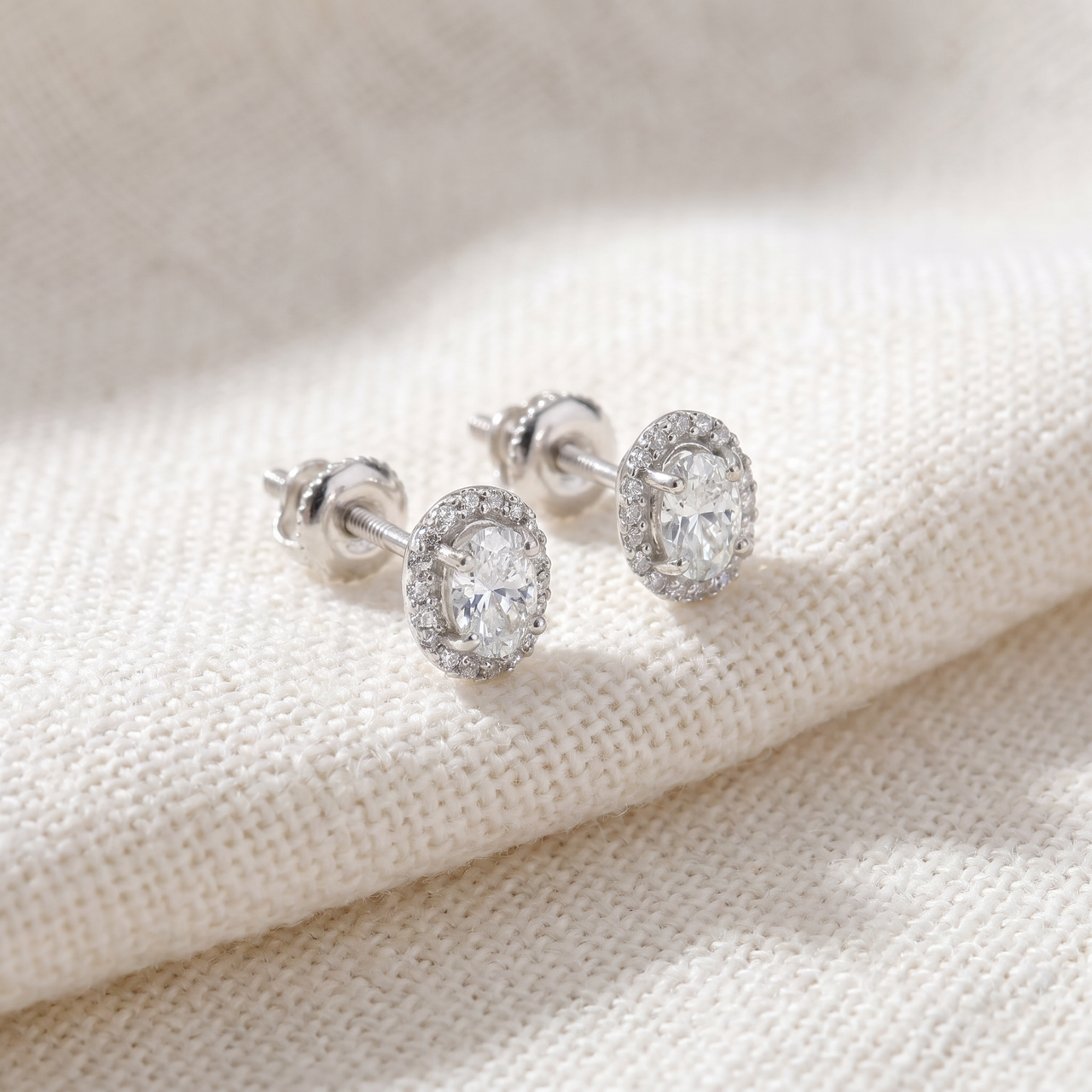 1/2Ct TW Oval Shape Halo Diamond Studs 10k White or Yellow Gold Earrings (H-I, I1)